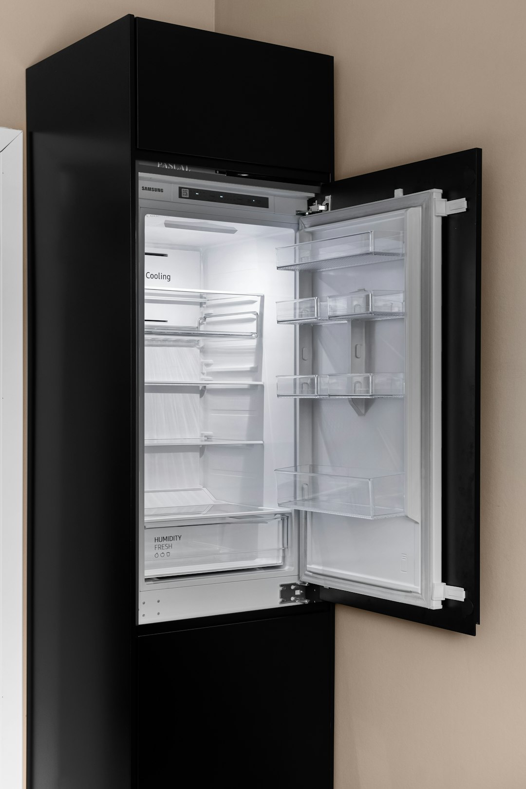 a-black-refrigerator-with-its-door-open-in-a-kitchen-ijfdxaim6be